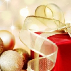 Christmas gift on defocused lights background